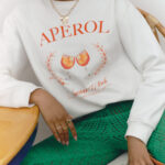 Aperol Spritz y Falabella fusionan moda y estilo de vida con su primera colección exclusiva